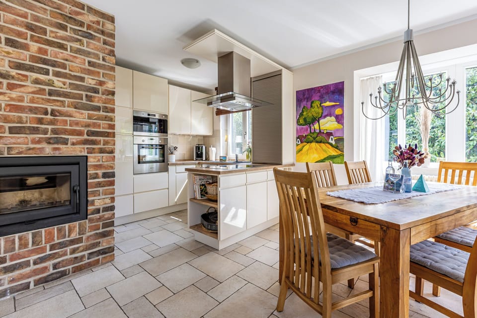 Modern Kitchen with Dining Table and Large Windows