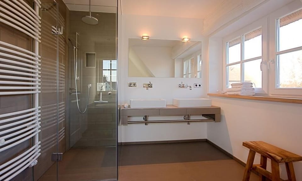 Modern bathroom with shower and double sink