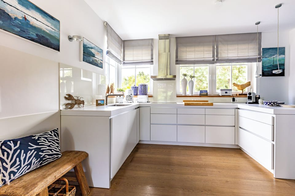 Modern Kitchen with White Cabinets and Wooden Floor