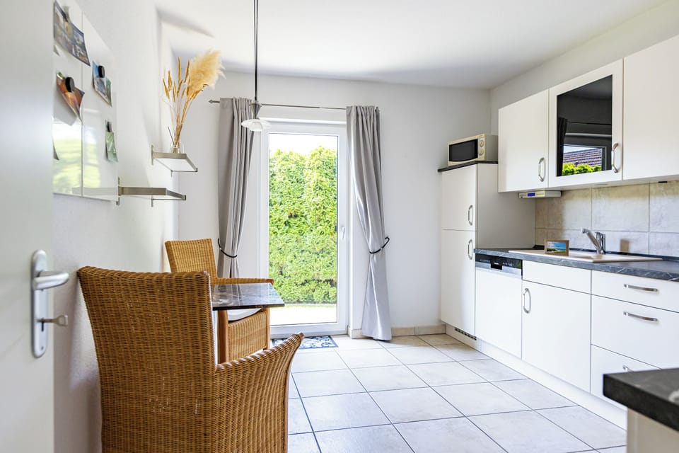 Modern Kitchen with Dining Area and Garden Access