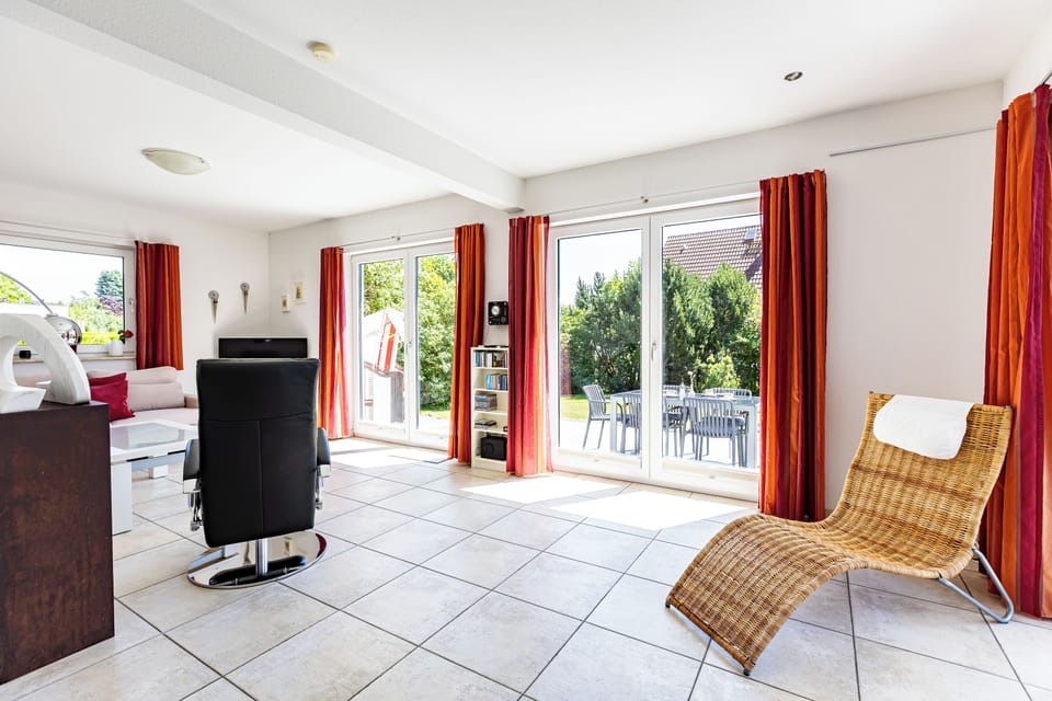 Bright Living Room with Large Windows and Chair