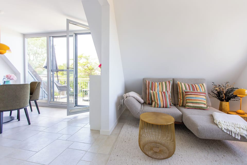 Bright Living Room with Sofa and Dining Table