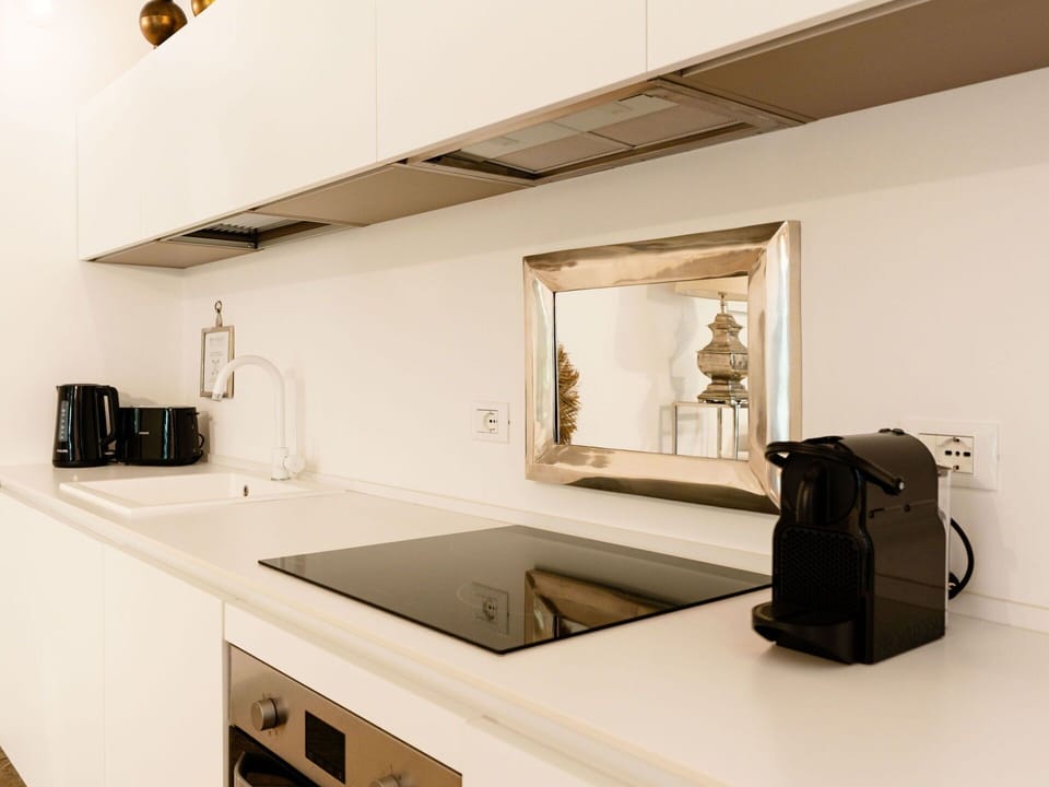 Kitchen, Countertop, Interior Design, Kitchen Appliance, Cabinetry, Lighting, Furniture, Room, Tap, Flooring