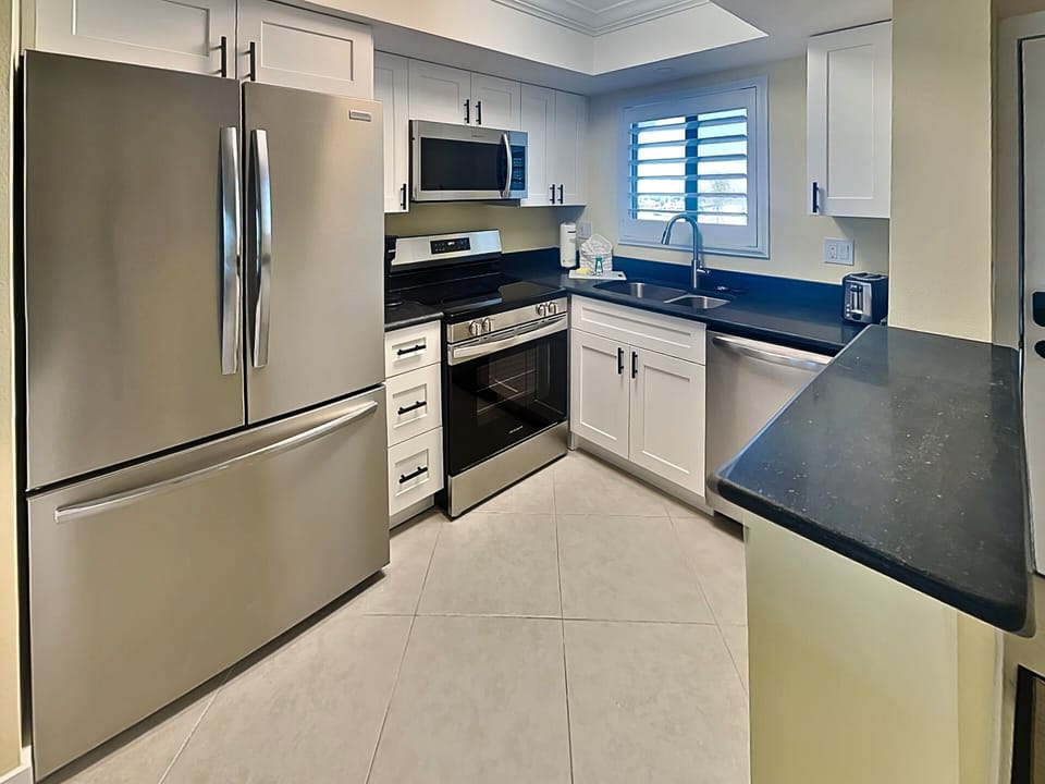Fully Equipped Kitchen with Stainless Steel Appliances