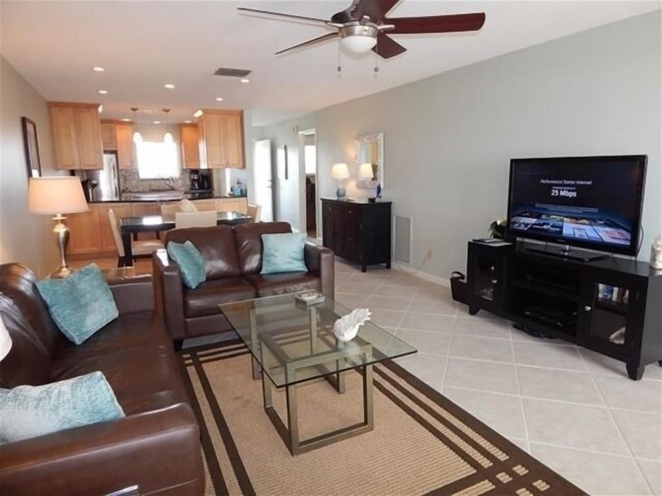 Living Area - Comfortable seating and large, flat-screened television.