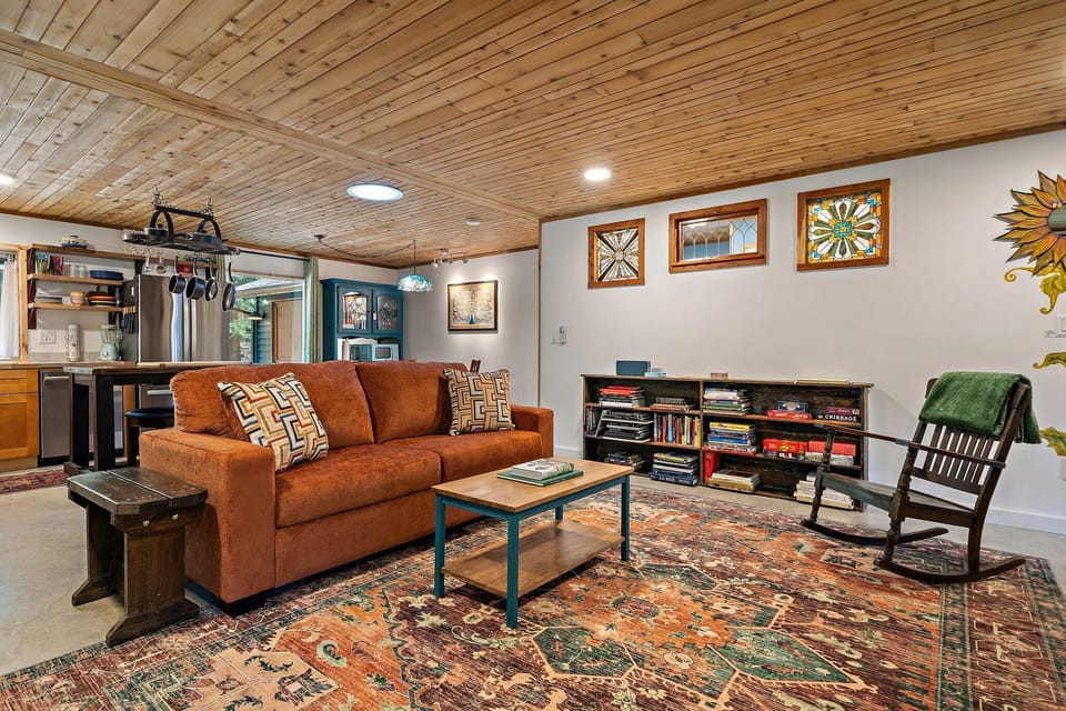 Whether you're unwinding after a hike or starting your day, this living space offers comfort in every corner.