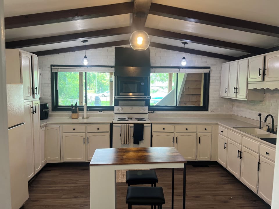 Kitchen with small island and seating for 2. 
