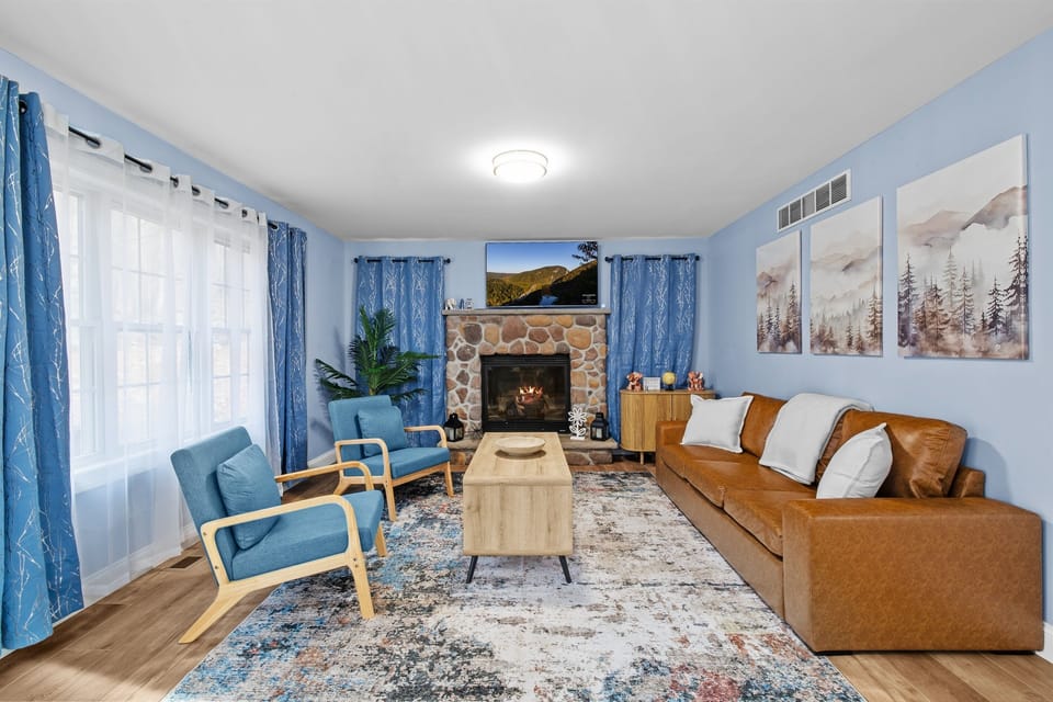 Living room with comfortable seating, propane fireplace, smart TV