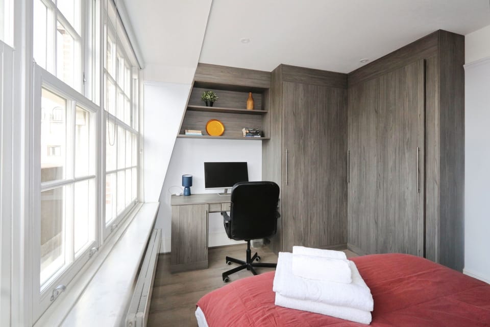 Bedroom 3 with fitted wardrobes and work station 