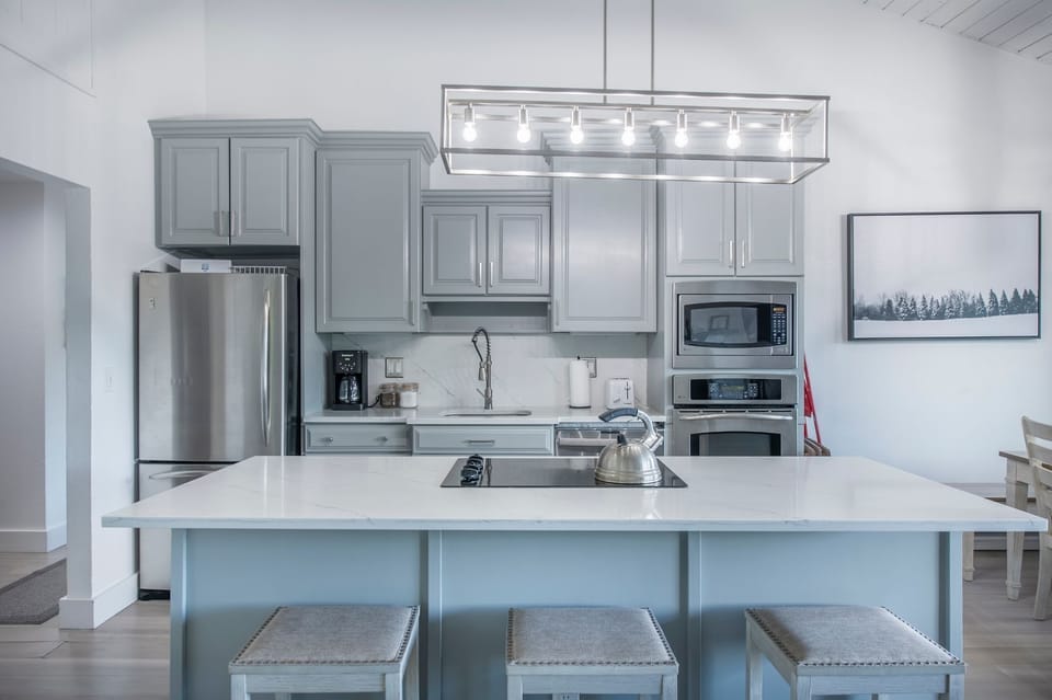Upgraded lighting throughout condo. Oven, microwave, cooktop, drip coffee pot