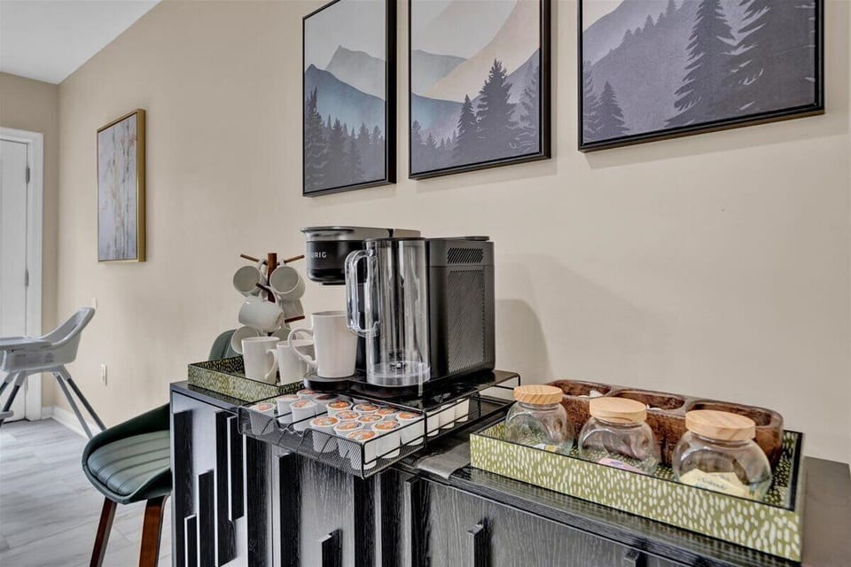 Start your day in comfort with a fresh coffee in hand and forest-inspired artwork to set the tone.