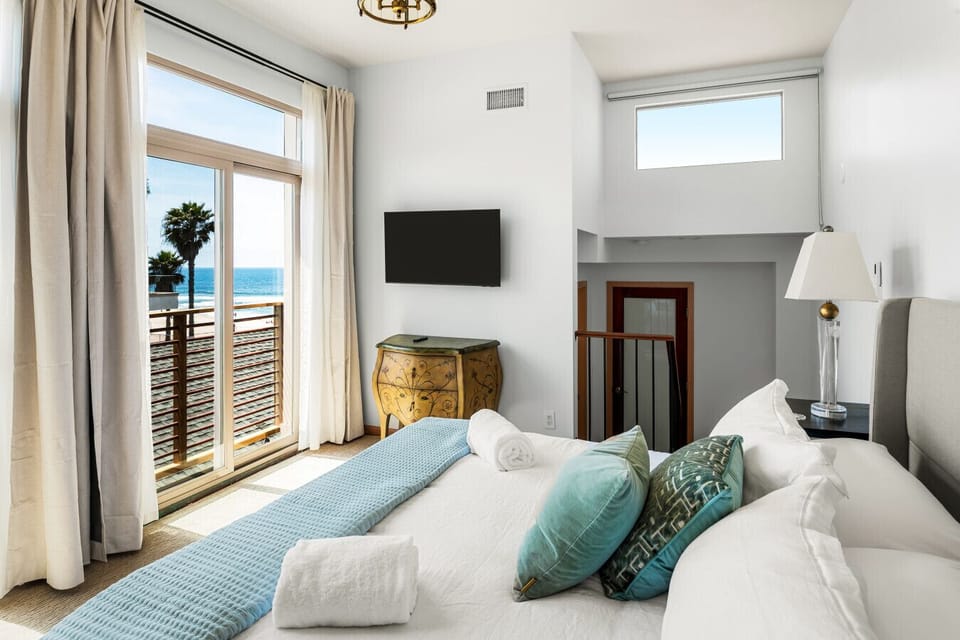 Coastal elegance meets comfort in this airy suite with a plush king-size bed.