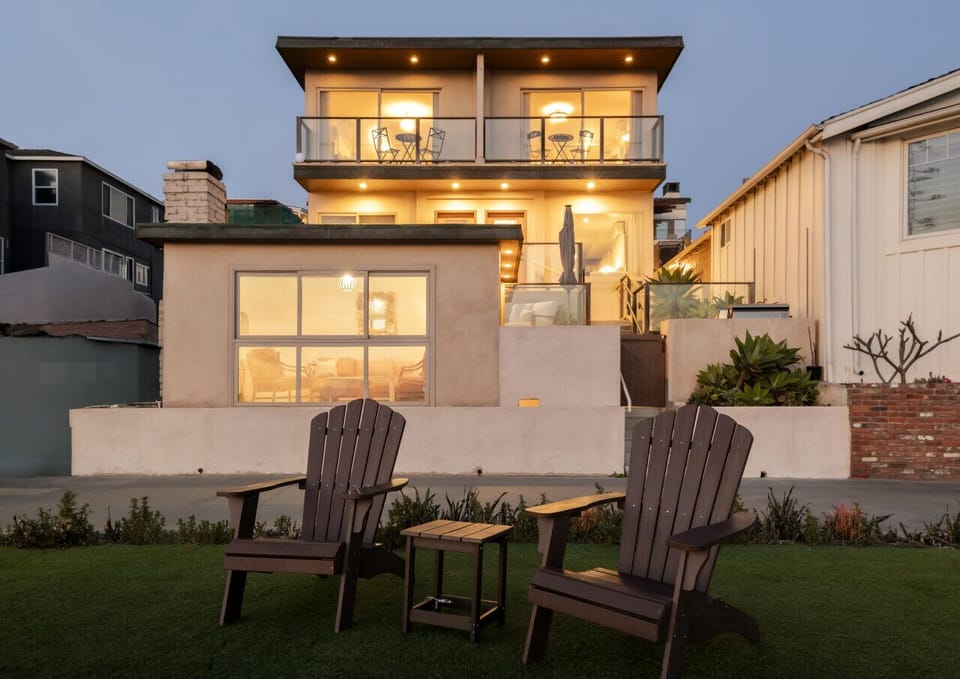 Golden hour glow at your beachfront retreat—where every level opens to comfort and coastal charm.