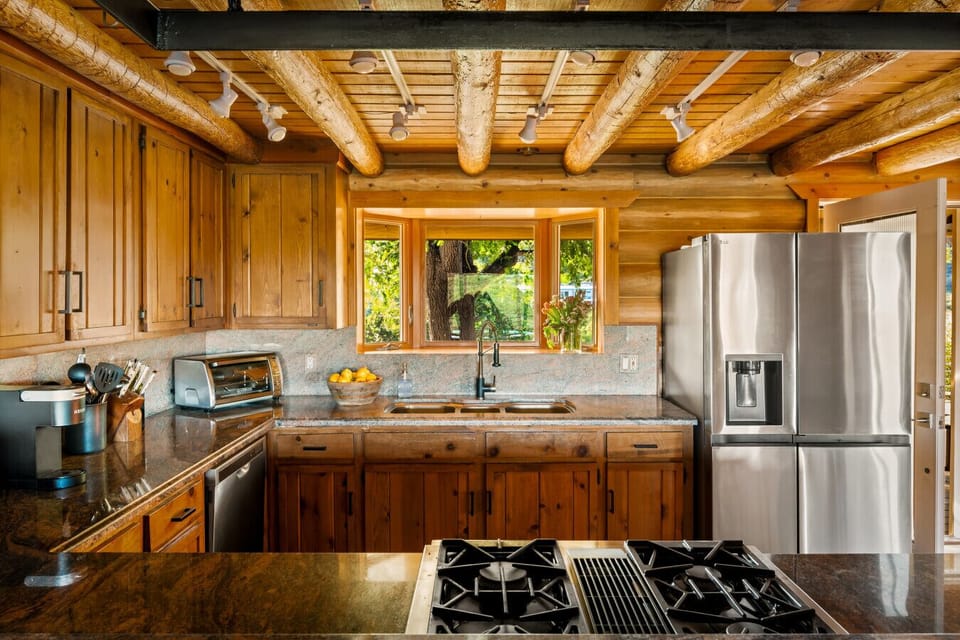 Rustic wood meets modern stainless in this fully equipped kitchen.