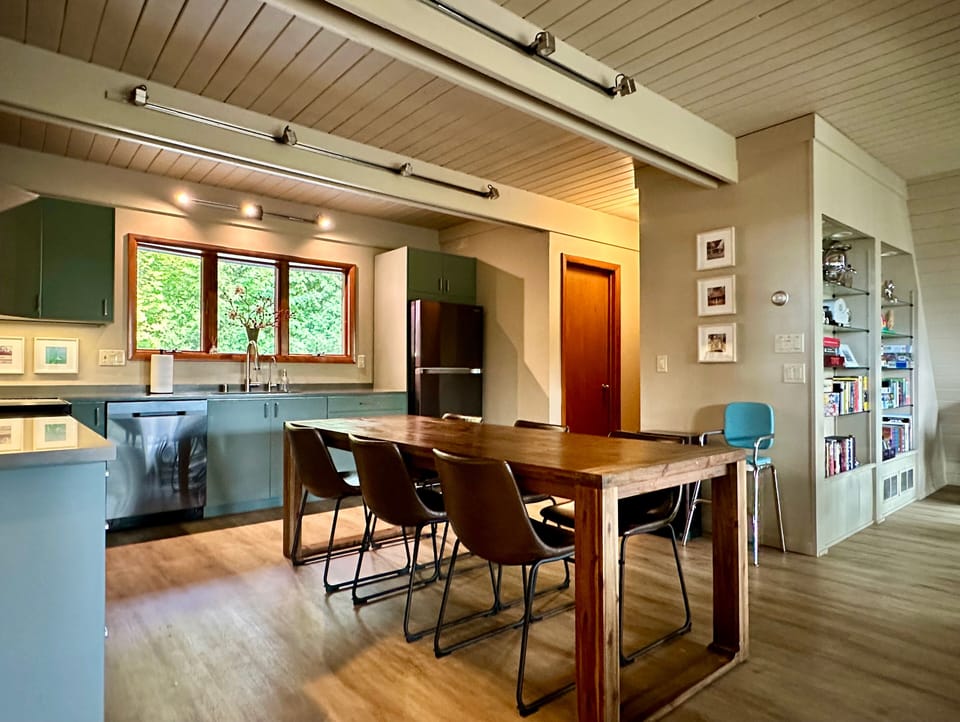 The table expands to accommodate up to eight eaters and game players.