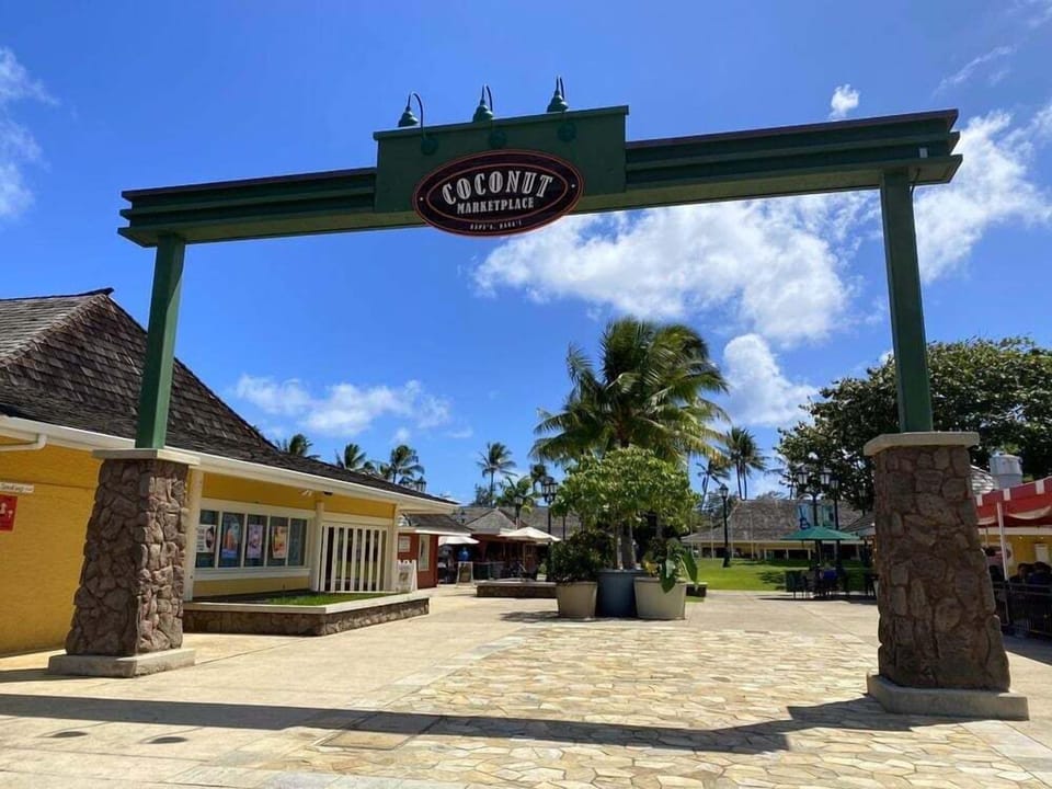 Charming open-air shopping at Coconut Marketplace with tropical vibes, located a short walk away.