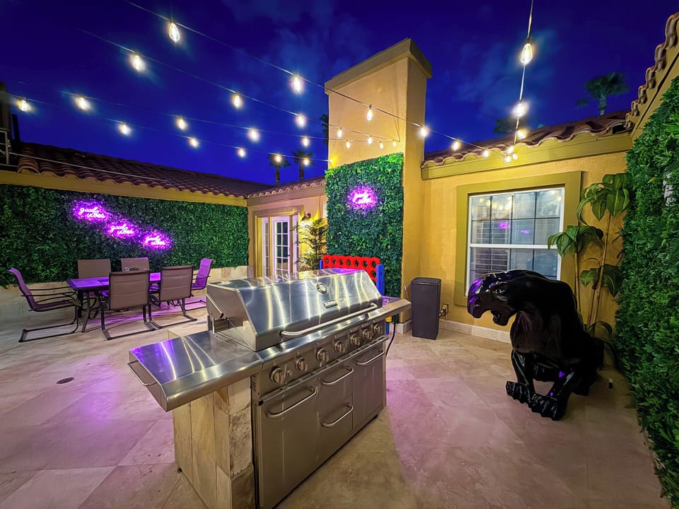 Jungle-themed center courtyard with outdoor dining and built-in BBQ