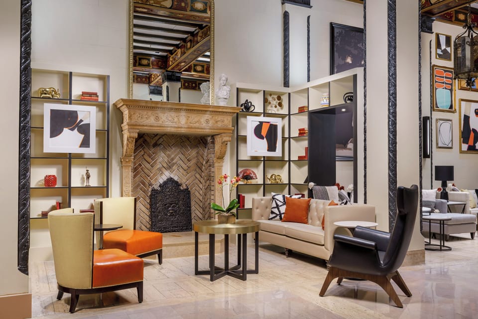 Unwind by the grand fireplace in a designer lounge setting.