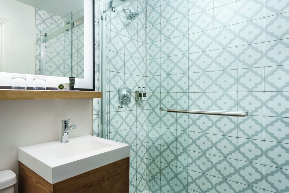 Refresh effortlessly in a sleek shower with modern finishes.