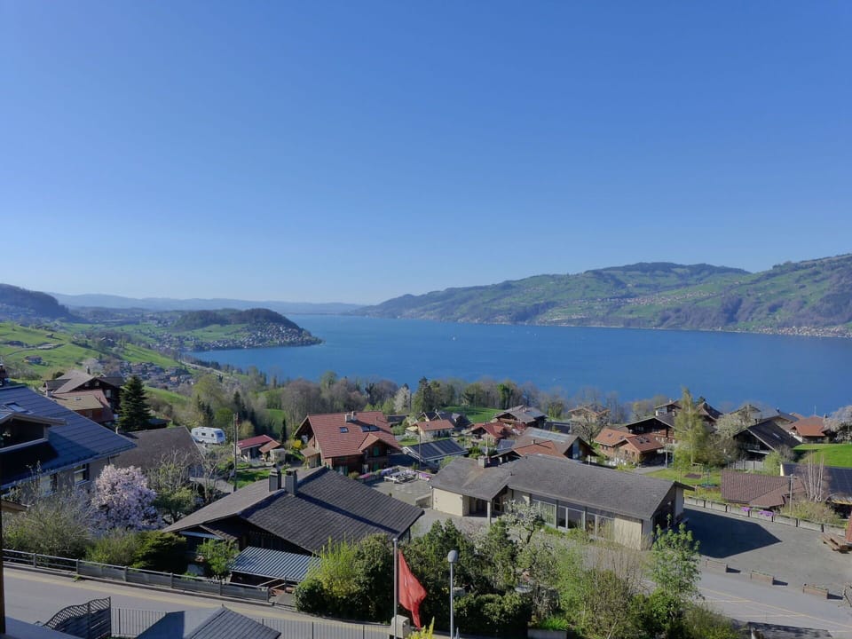 Body Of Water, Mountainous Landforms, Hill, Highland, Landscape, House, Coastal And Oceanic Landforms, Bank, Human Settlement, Coast