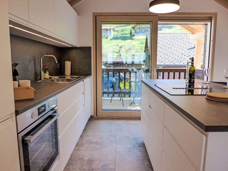 Kitchen, Countertop, Kitchen Appliance, Cabinetry, Interior Design, Flooring, Furniture, Kitchen Sink, Major Appliance, Wood