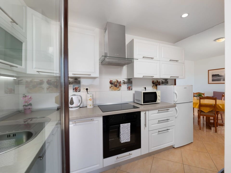 Furniture, Wood, Interior Design, Cabinetry, Kitchen, Flooring, Countertop, Cupboard, Room, Wood Stain