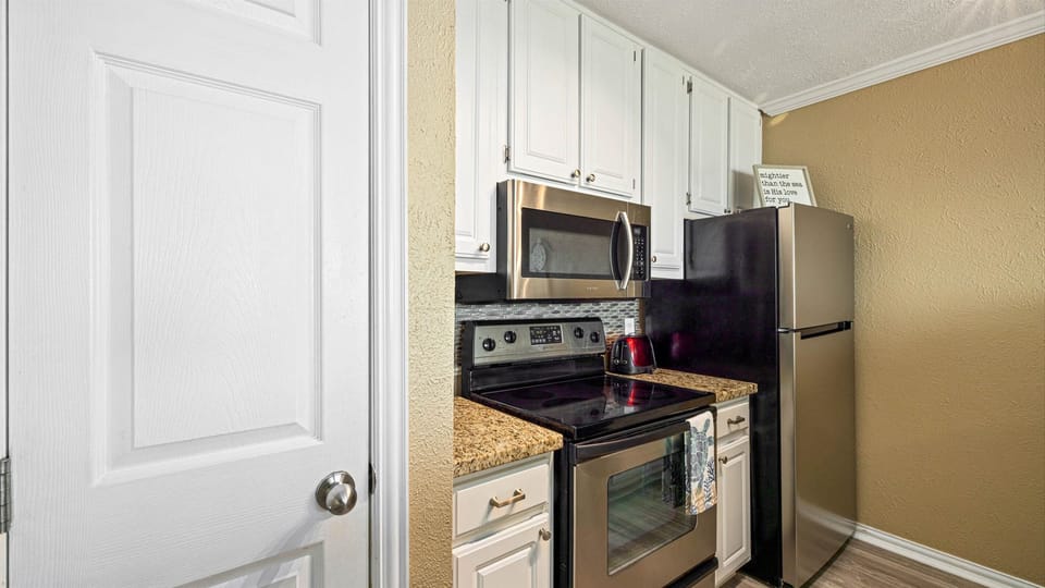 Kitchen with full size stainless appliances.
