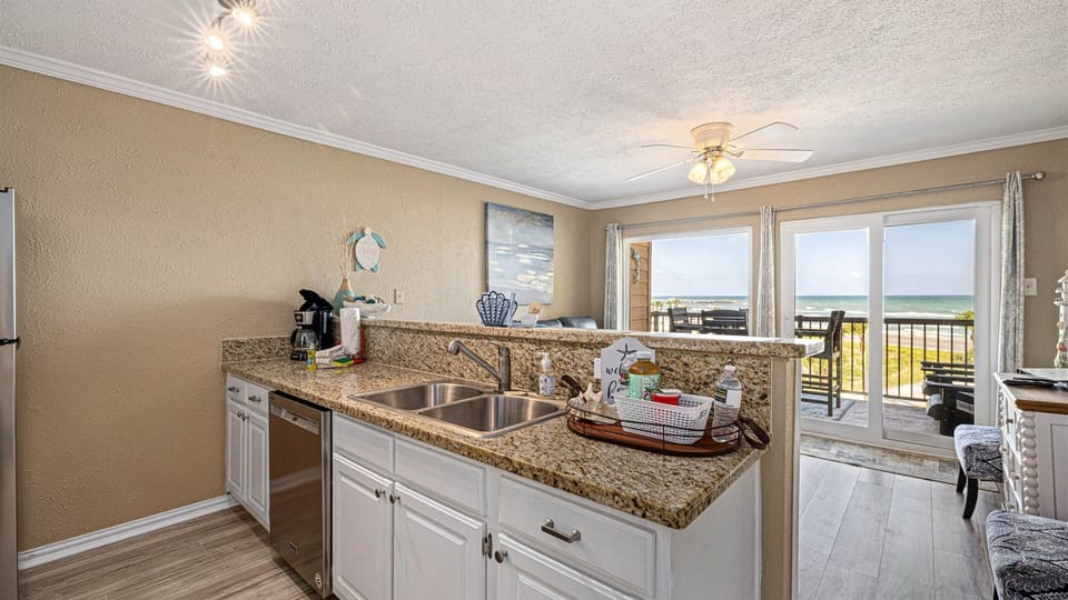 Large bar with double sink in the kitchen.