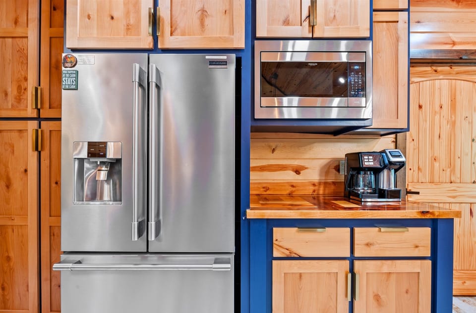 Fully equipped and ready for anything—this kitchen offers stainless steel appliances, a coffee station, and all the tools you’ll need.
