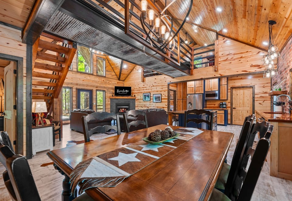 There’s no shortage of seating here—this open-concept dining area flows effortlessly into the kitchen and living room for easy entertaining.
