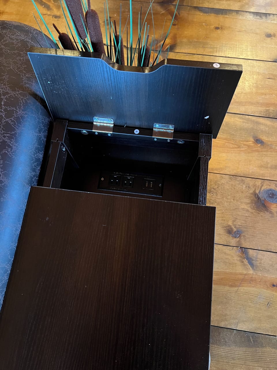 a charging station end table in the living room