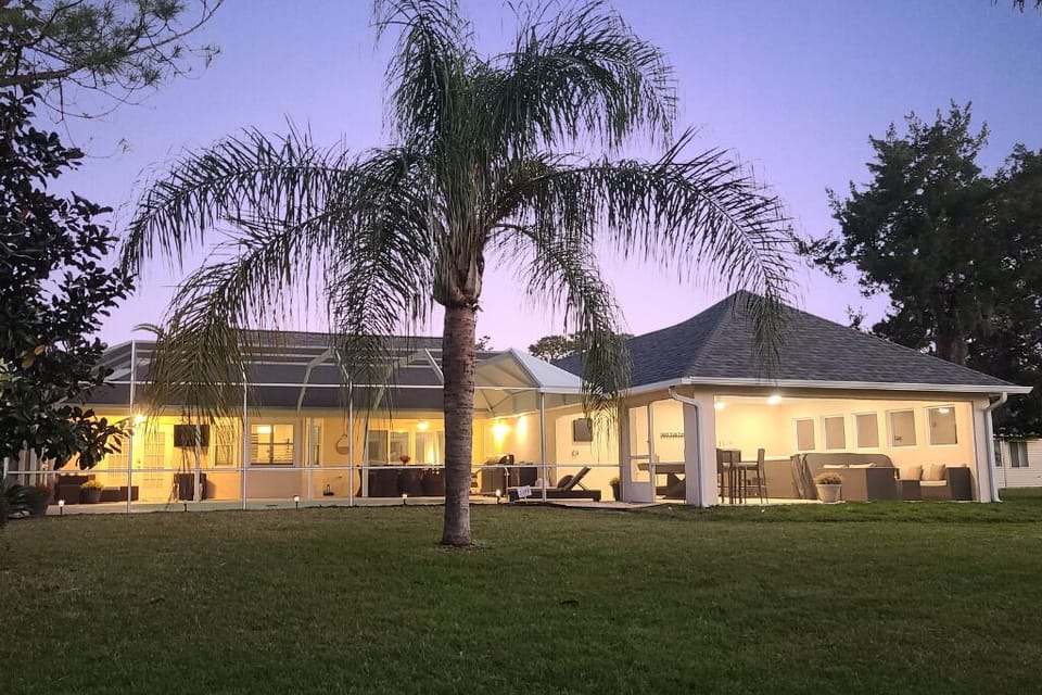 The 1,700 foot lanai and outdoor living area. Well lit and fully screened.