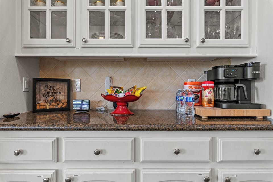 Coffee area with Keurig and full coffee pot.