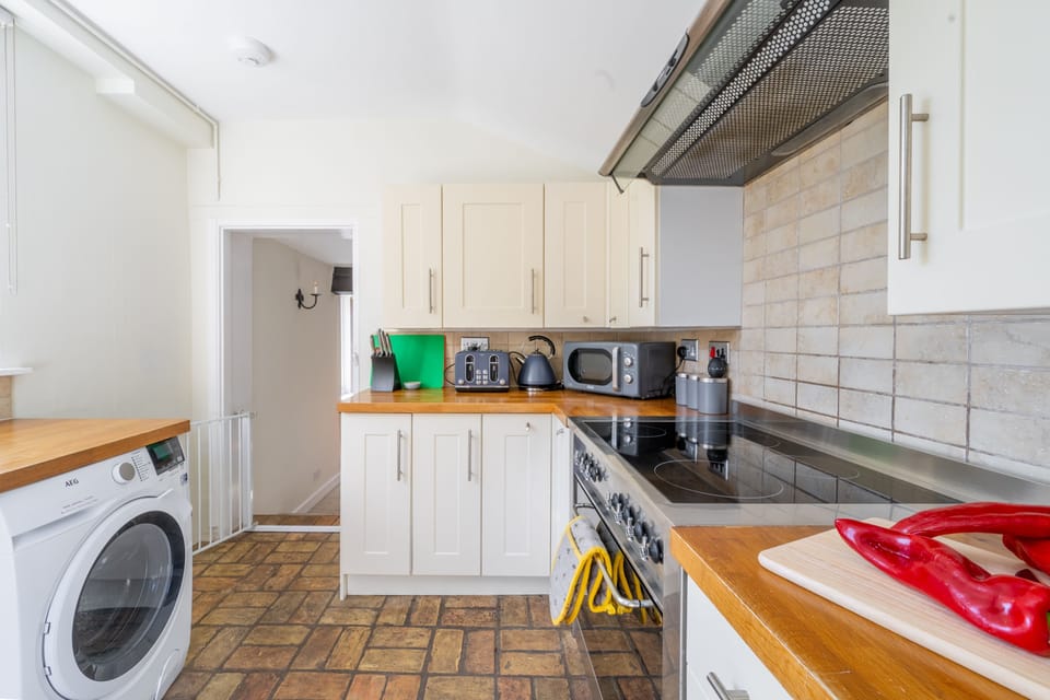Ground floor: Kitchen with washing machine, dish washer, oven and induction hob