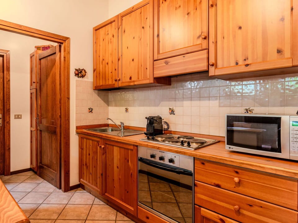 Wood, Interior Design, Cabinetry, Kitchen, Flooring, Room, Wood Stain, Floor, Drawer, Furniture