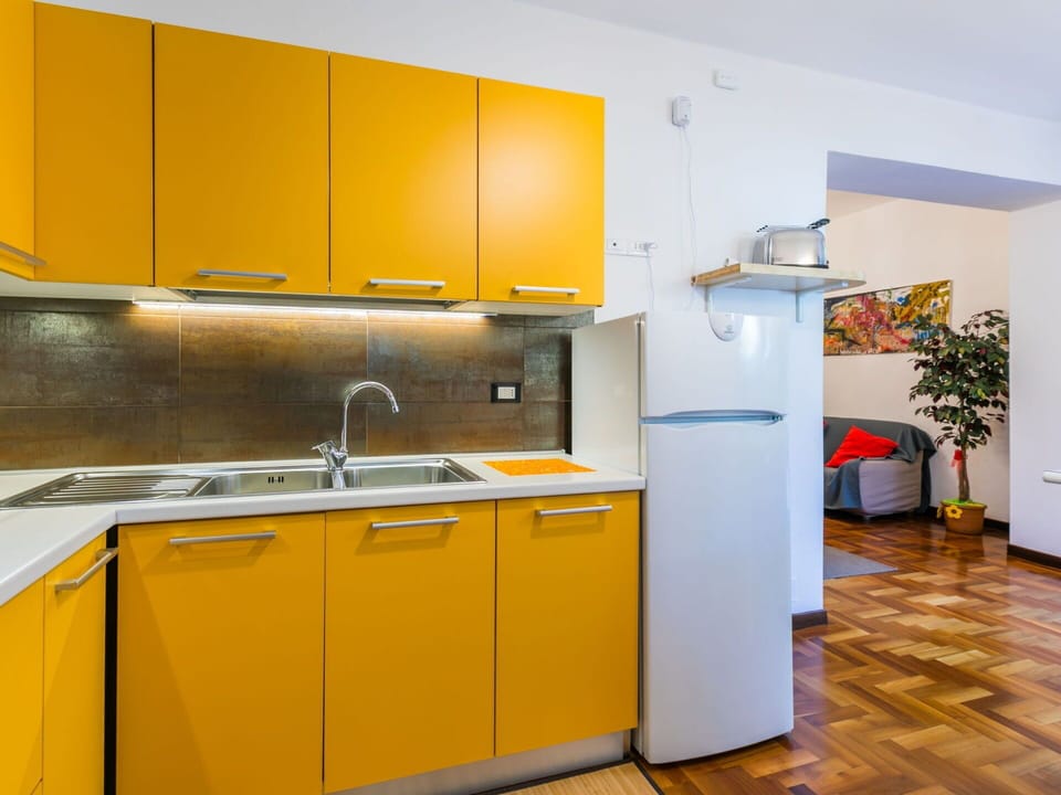 Kitchen, Kitchen Appliance, Major Appliance, Countertop, Interior Design, Flooring, Wood, Yellow, Cabinetry, Kitchen Sink