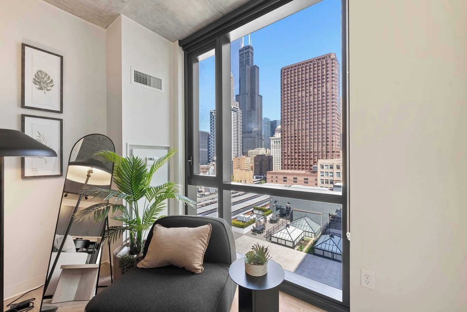 Bright corner space w/ seating and views that bring the outside light indoors.