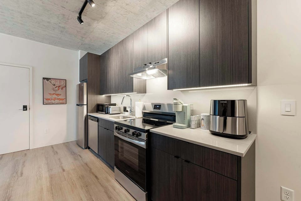 Streamlined kitchenette offers an efficient layout for quick bites and snacks.