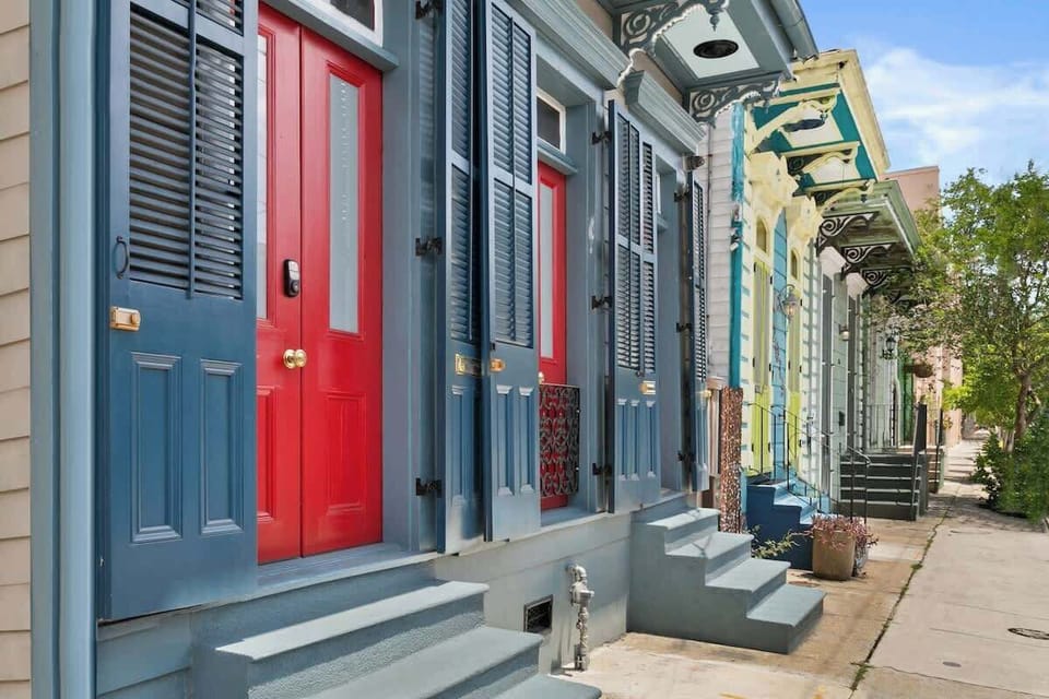 Colorful historic façade with charming shutters and your private red door entrance. Steps from Frenchmen Street’s live music and cafés, offering an authentic New Orleans arrival.