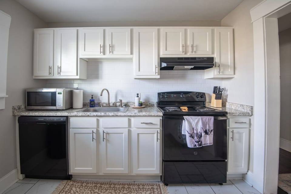 Modern kitchen with stainless steel appliances and all the essentials for cooking
