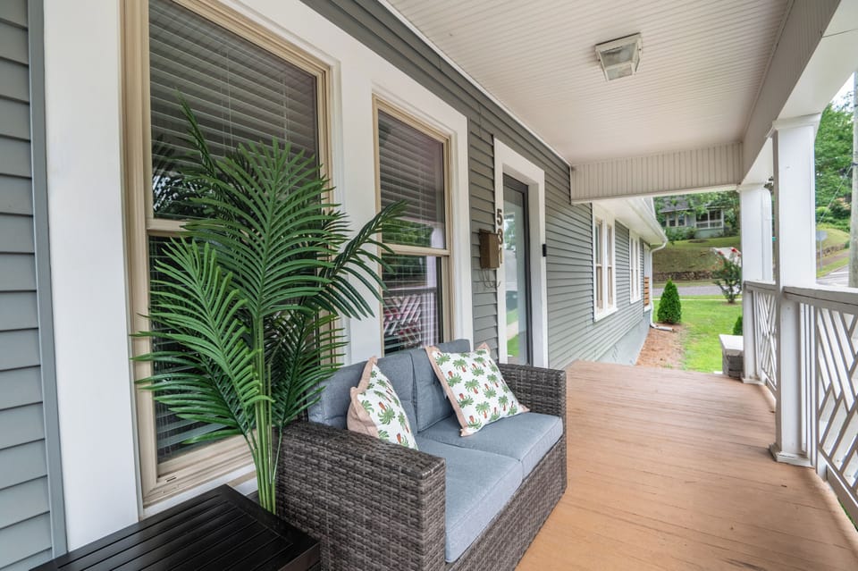 Welcome to Serenity: Embrace the charm of our welcoming front patio, where relaxation begins.  Get in touch to explore our custom concierge services and local experiences curated just for you.