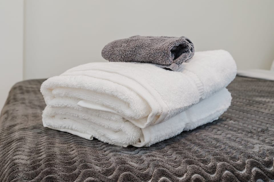 Soft, high-quality towels provided to enhance your bathing experience.