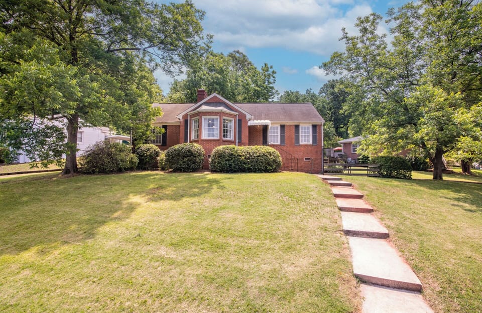 As you approach out Glen Iris Garden Haven, you are greeted by a charming and well-maintained house, right on the corner!