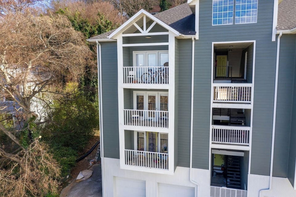 The elegant exterior of Hilltop Hideaway, showcasing its inviting design and balconies.