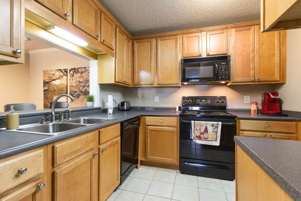 Functional Kitchen Design: A sleek and practical kitchen featuring wooden cabinetry and modern appliances.