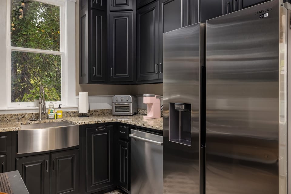 Prepare meals in our modern kitchen, equipped with sleek stainless steel appliances for your culinary convenience. Reach out to us for our personalized concierge services and handpicked local experiences. 