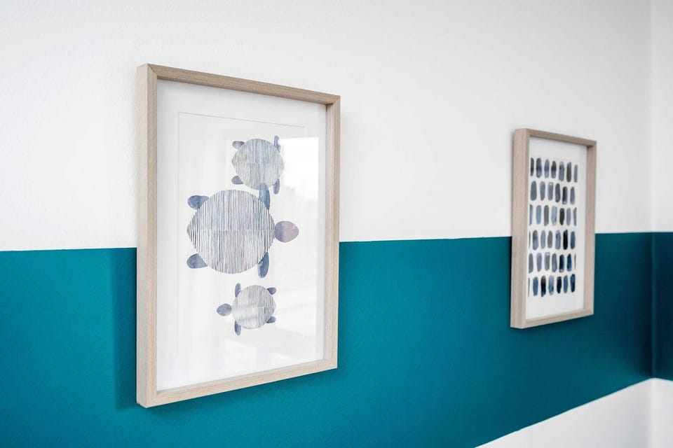 Framed pictures on the wall.