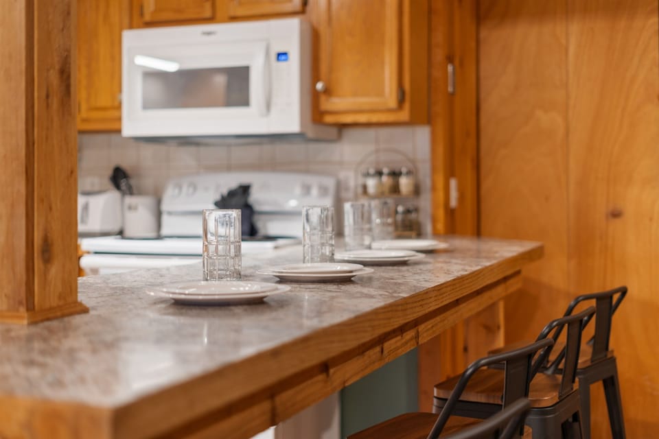 A favorite guest feature: the bar seats four and makes a great spot for quick bites or kid time!