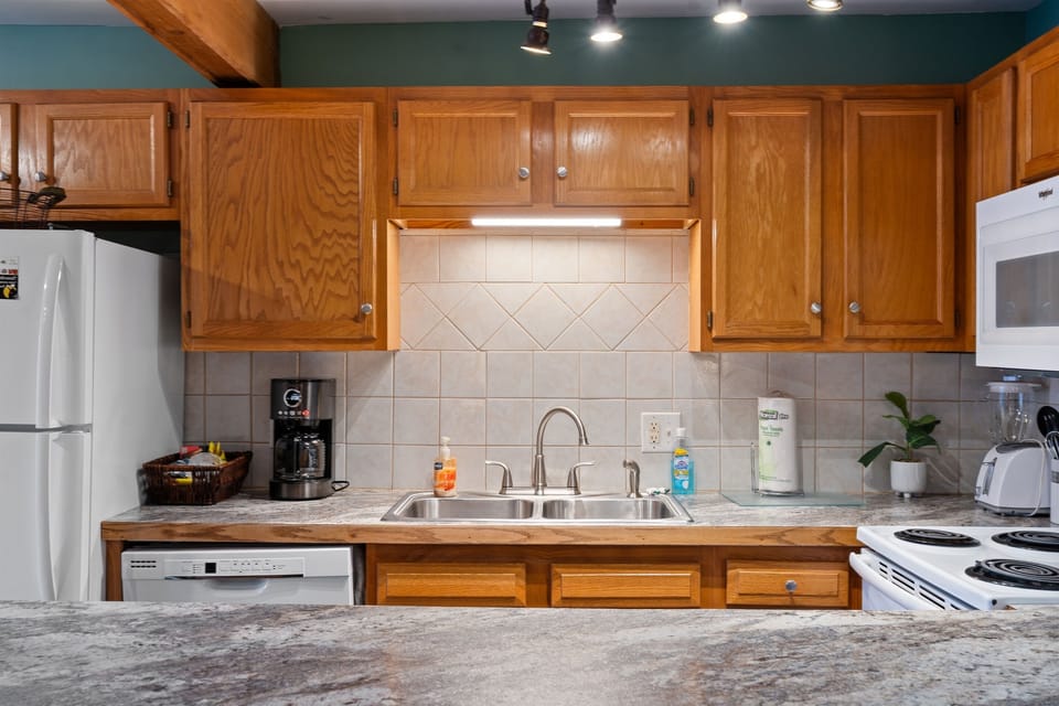 From morning coffee to evening meals, this kitchen is ready with full appliances and plenty of cookware