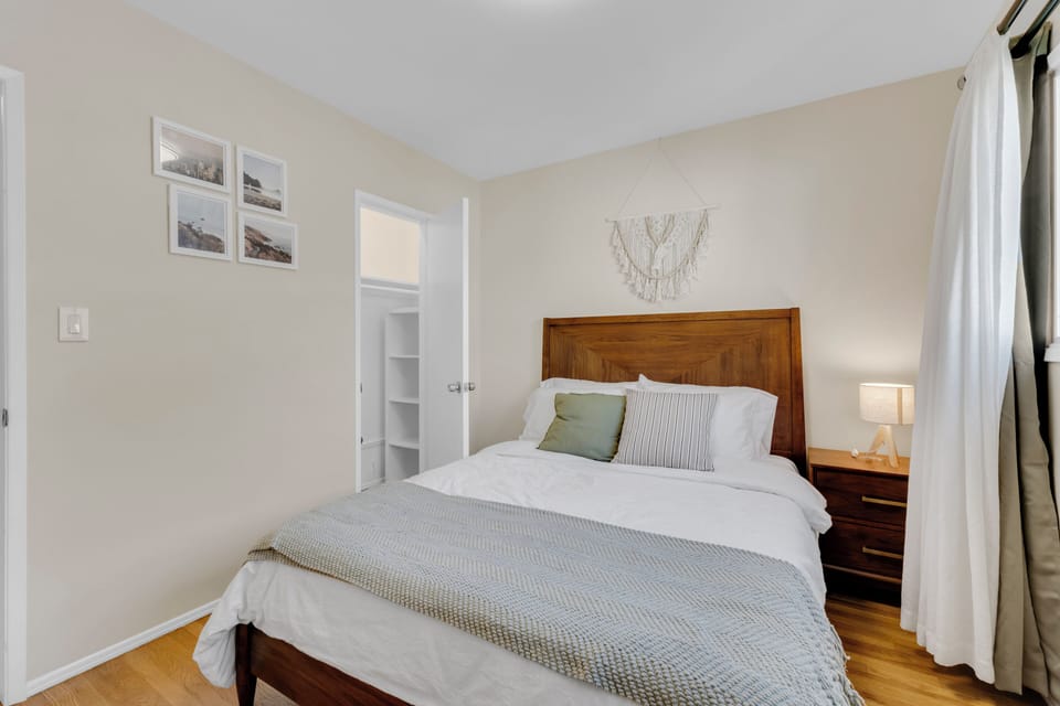 Bedroom 2 includes a closet, suite case storage rack, and blackout curtains.